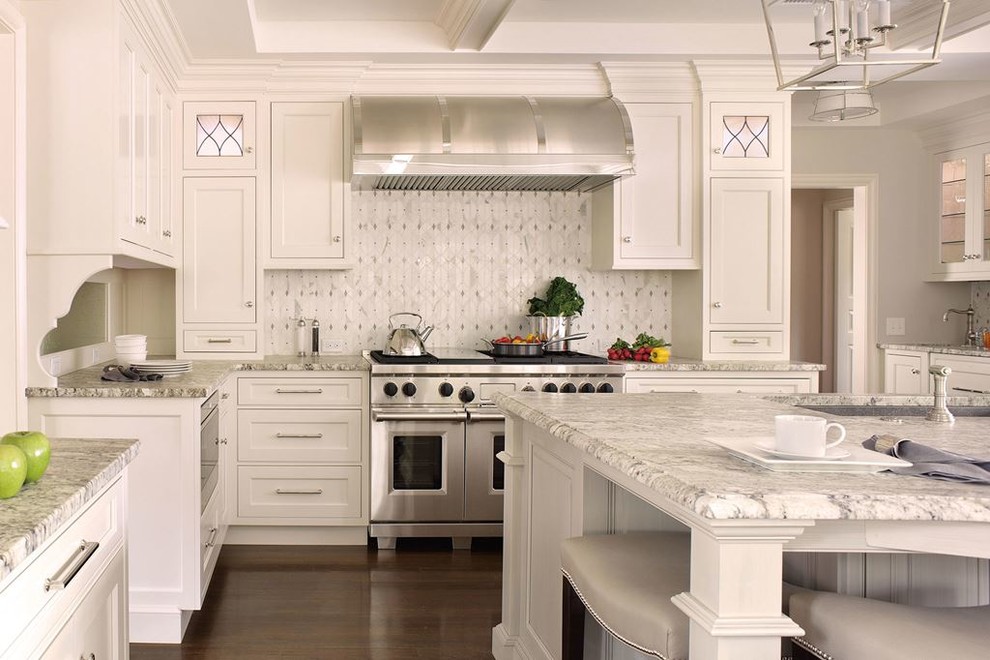 Large transitional l-shaped dark wood floor kitchen pantry photo in Denver with a drop-in sink, shaker cabinets, white cabinets, laminate countertops, multicolored backsplash, mosaic tile backsplash, stainless steel appliances and an island