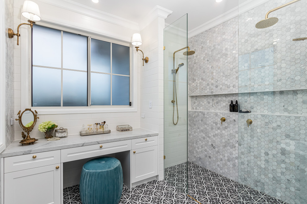 Design ideas for a beach style bathroom in Townsville with shaker cabinets, white cabinets, a curbless shower, gray tile, mosaic tile, white walls, black floor, an open shower, grey benchtops, a niche, a built-in vanity and planked wall panelling.