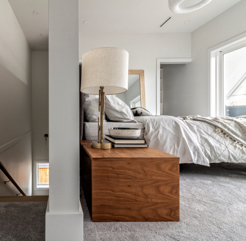 Medium sized contemporary master bedroom in Vancouver with white walls, carpet and grey floors.