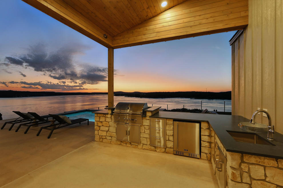 Large minimalist backyard rectangular pool photo in Dallas
