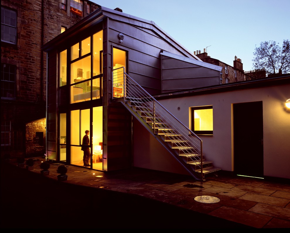 Design ideas for a small contemporary two-storey exterior in Edinburgh with metal siding.