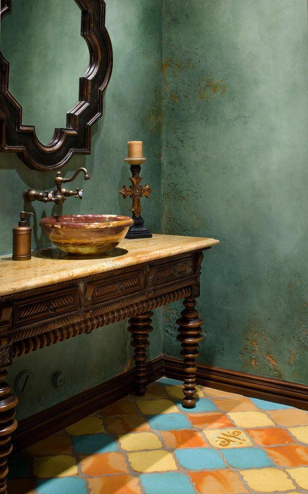 Tuscan terra-cotta tile powder room photo in Austin with a vessel sink, furniture-like cabinets, dark wood cabinets and green walls