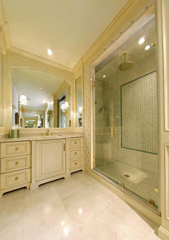 Expansive traditional master bathroom in Philadelphia with beaded inset cabinets, white cabinets, a double shower, white tile, stone tile, white walls, marble floors, an undermount sink and granite benchtops.