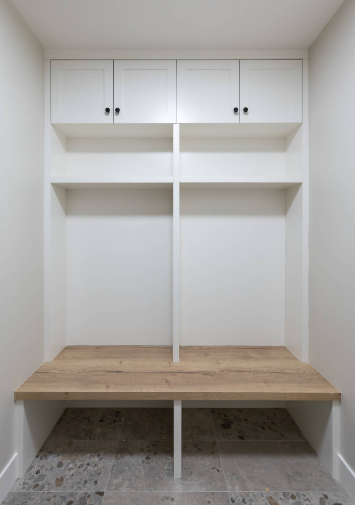 Mid-sized transitional porcelain tile and gray floor mudroom photo in Calgary with white walls
