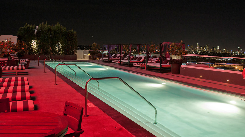 Inspiration for a large modern rooftop rectangular lap pool in Los Angeles with concrete slab.