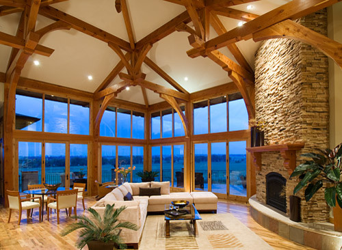 Living room - large traditional open concept and formal light wood floor and brown floor living room idea in Denver with white walls, a corner fireplace, no tv and a stone fireplace