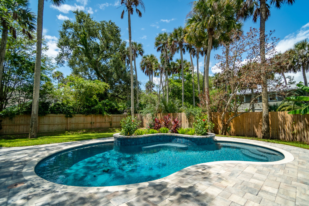 Inspiration for a mid-sized tropical pool in Jacksonville.