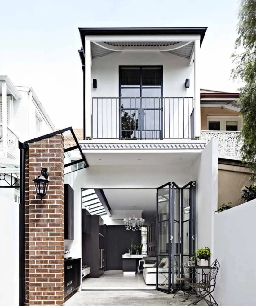 Design ideas for a mid-sized contemporary two-storey exterior in Sydney.