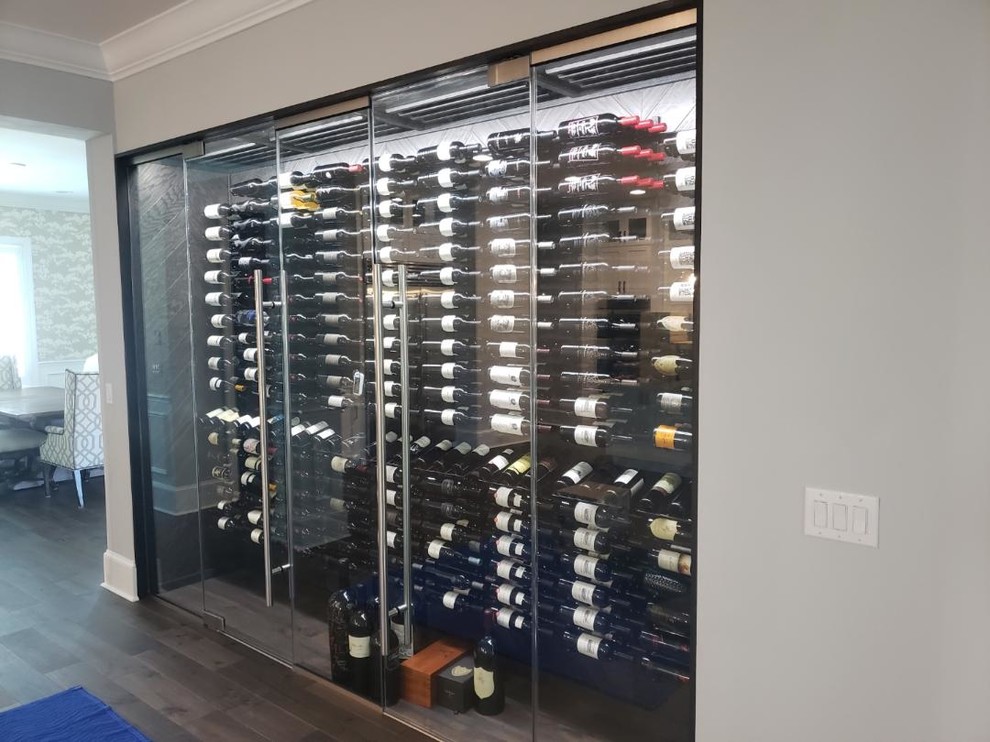 Inspiration for a modern wine cellar in Tampa with display racks.