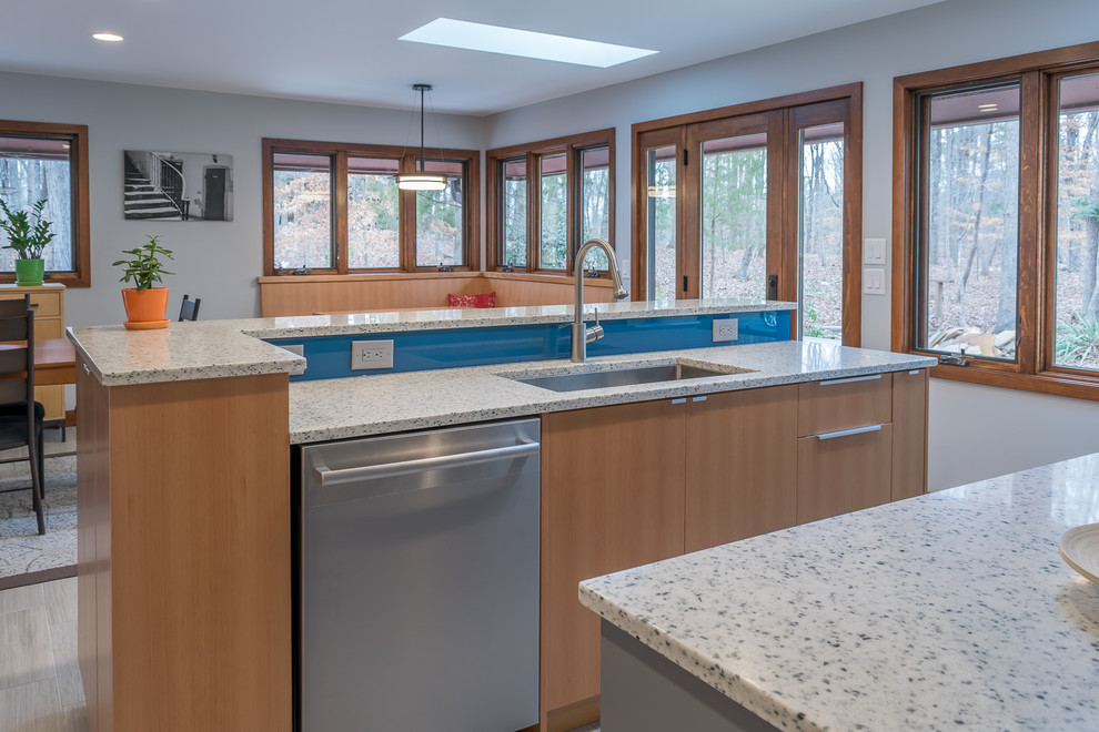 Design ideas for a mid-sized contemporary eat-in kitchen in Raleigh with a single-bowl sink, flat-panel cabinets, medium wood cabinets, recycled glass benchtops, blue splashback, glass sheet splashback, stainless steel appliances, ceramic floors, with island and grey floor.