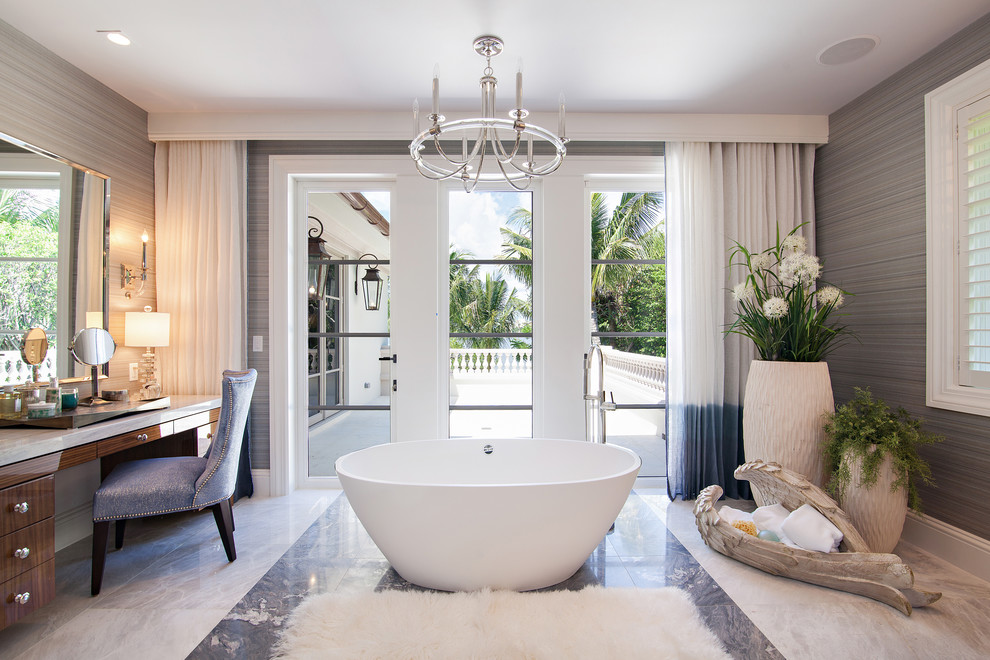 Inspiration for an expansive transitional master bathroom in Miami with medium wood cabinets, a freestanding tub, a curbless shower, gray tile, stone slab, grey walls, marble floors and marble benchtops.