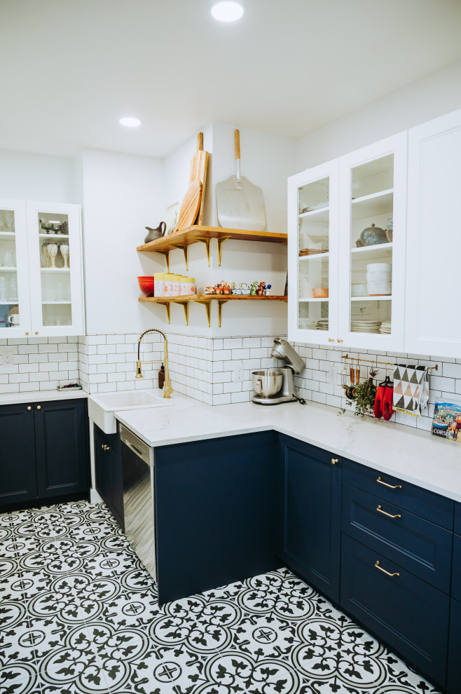 Enclosed kitchen - small transitional ceramic tile and multicolored floor enclosed kitchen idea with a farmhouse sink, recessed-panel cabinets, blue cabinets, quartz countertops, white backsplash, subway tile backsplash, stainless steel appliances, no island and white countertops