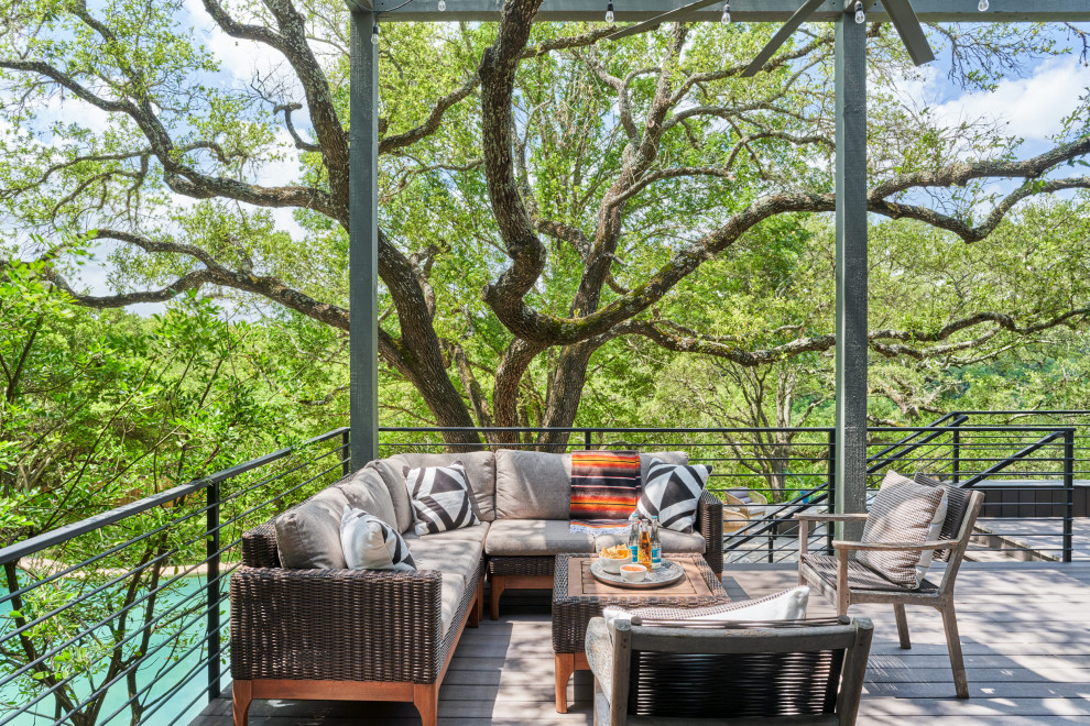 Medium sized contemporary back metal railing terrace in Austin.