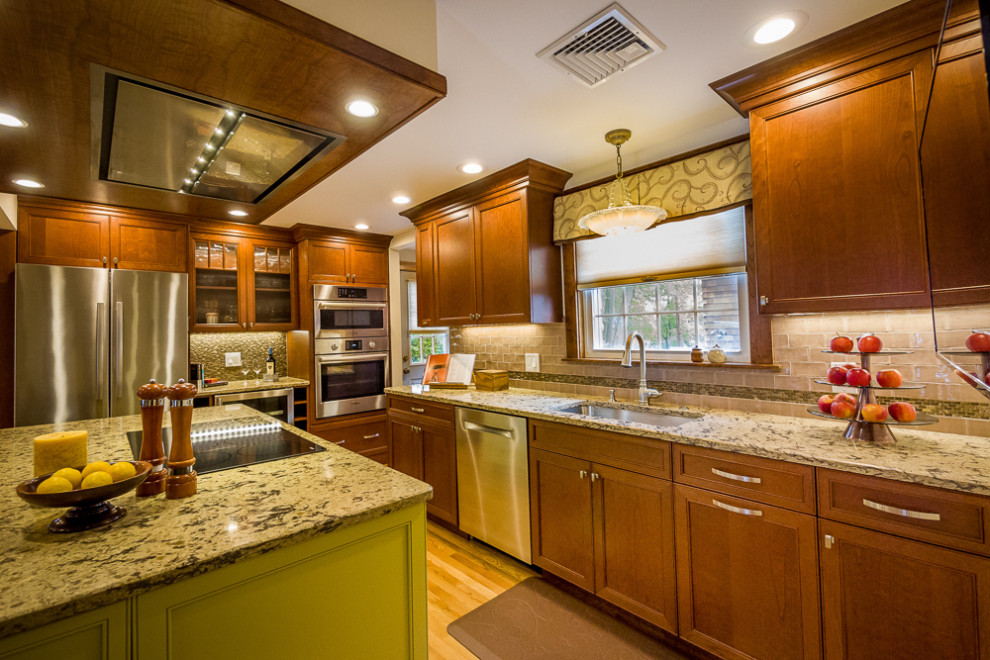 This is an example of a mid-sized contemporary open plan kitchen in Boston with shaker cabinets and with island.