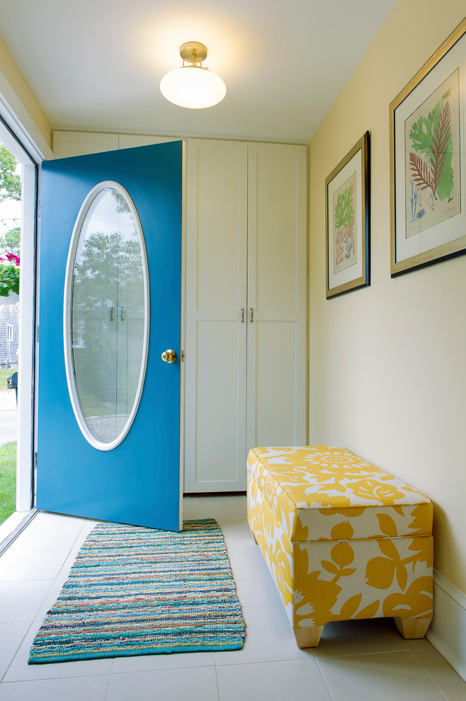 Inspiration for a beach style entryway in Boston with beige walls and a blue front door.