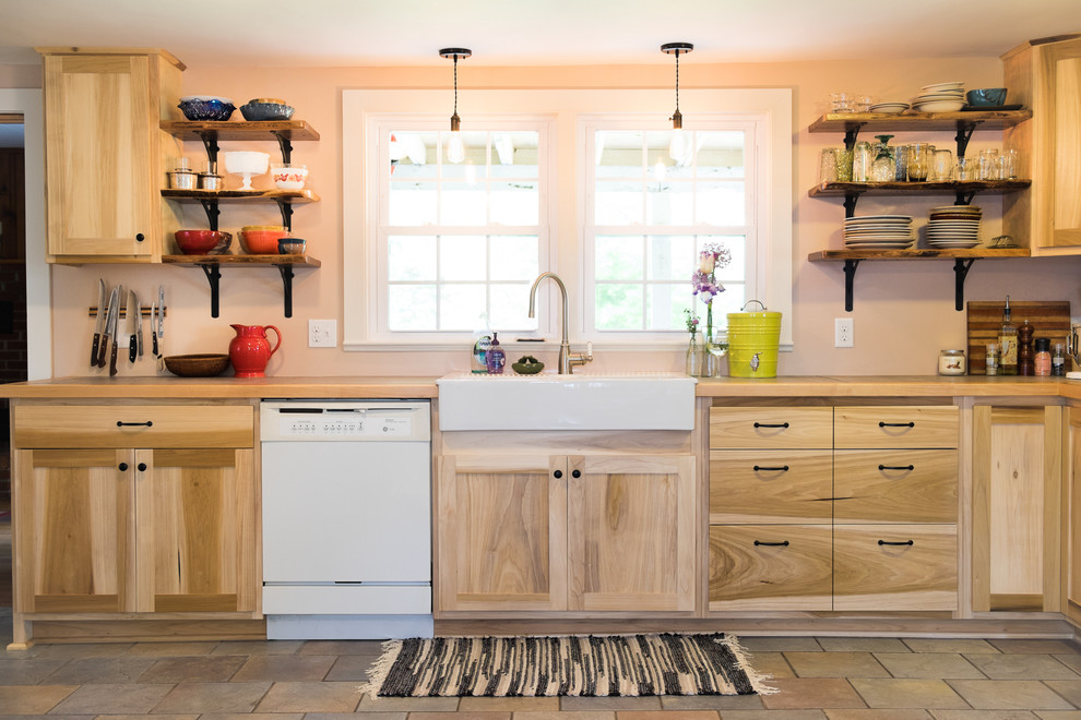 Design ideas for a mid-sized country l-shaped eat-in kitchen in DC Metro with a farmhouse sink, flat-panel cabinets, light wood cabinets, tile benchtops, white appliances, ceramic floors and no island.