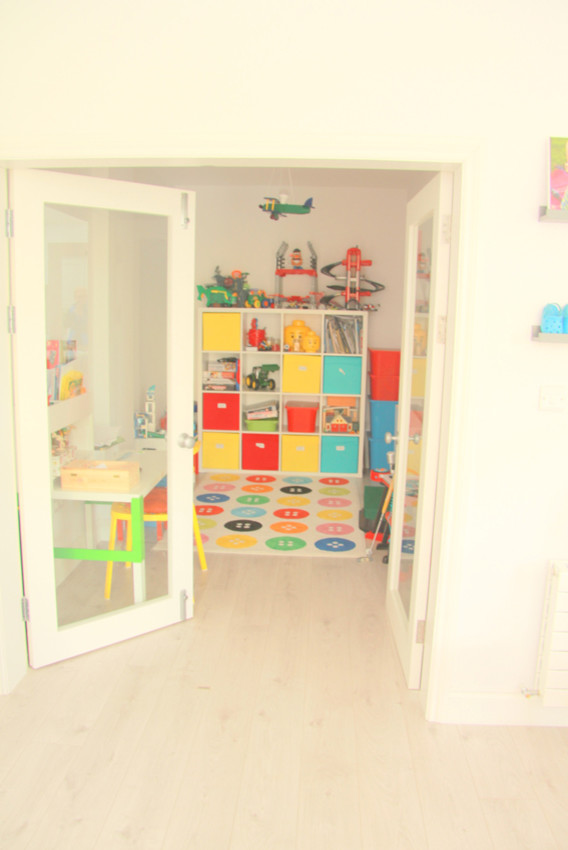 Mid-sized contemporary kids' room in Dublin.