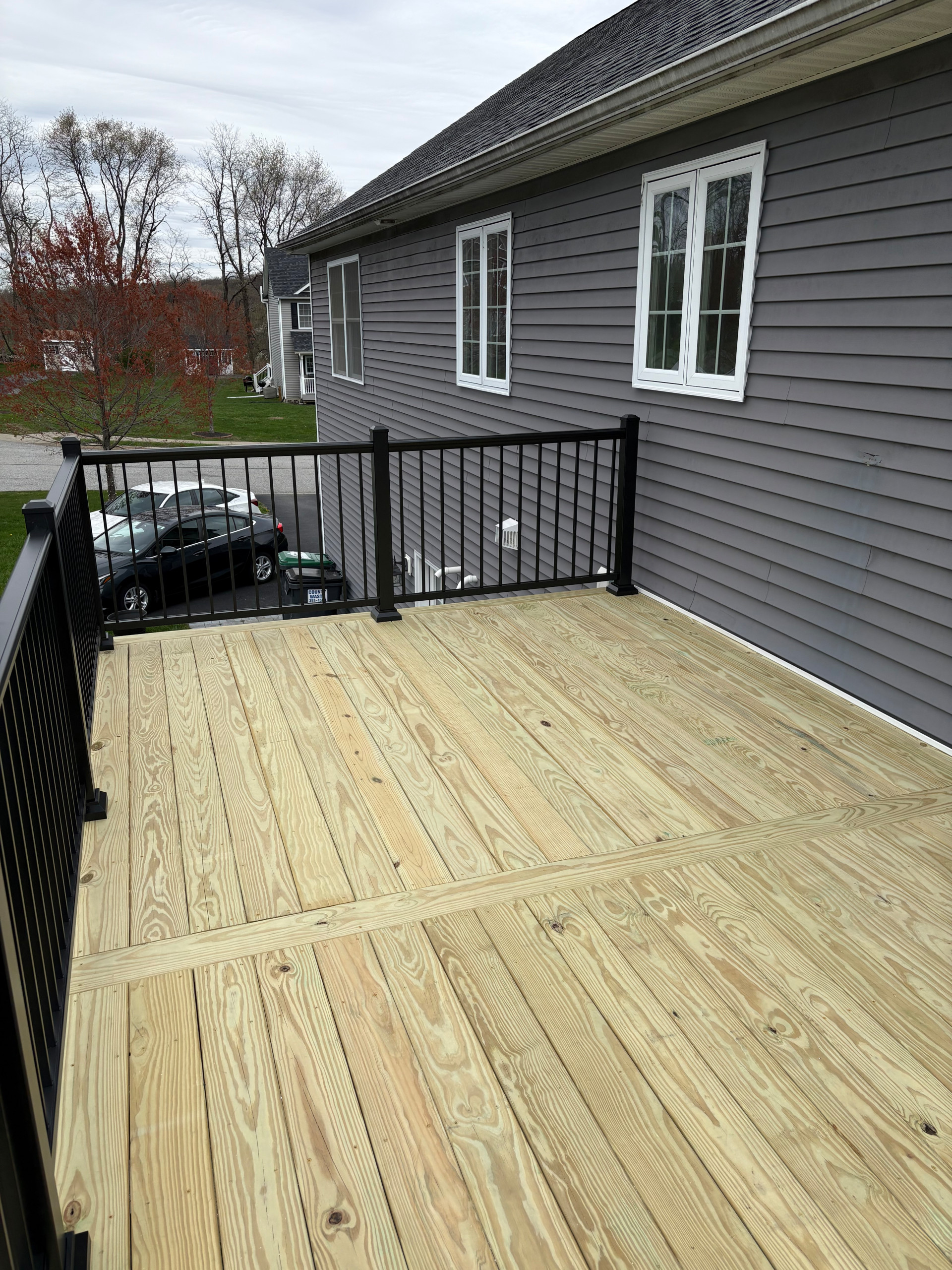 Pressure Treated Wood  Deck with black powder coated rail