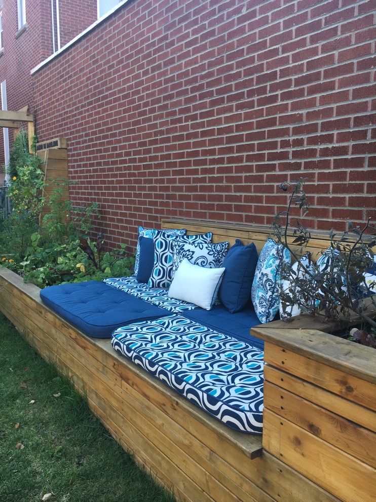 Small traditional backyard patio in Montreal with no cover.