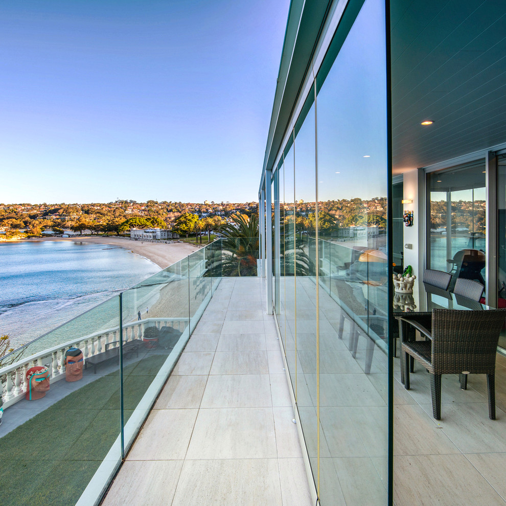 Contemporary balcony in Gold Coast - Tweed with a roof extension.