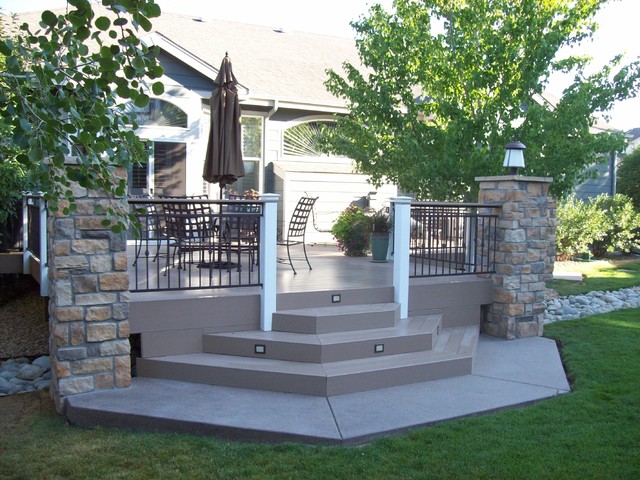 Custom Deck with Iron Railings, Stone Columns and Lighting contemporary-terrace