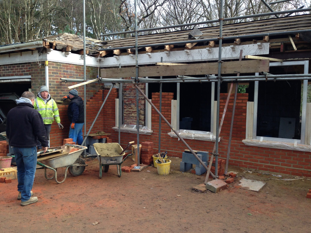 Front elevation - building new brickwork and stone window surrounds