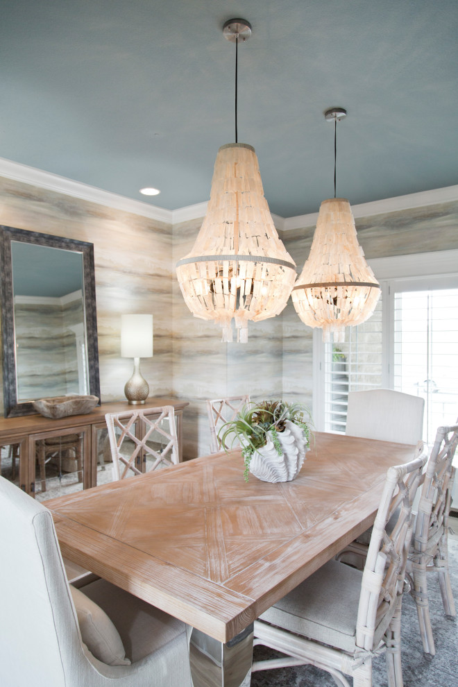 This is an example of a large beach style dining room in Kansas City with beige walls, light hardwood floors, beige floor, vaulted and wallpaper.