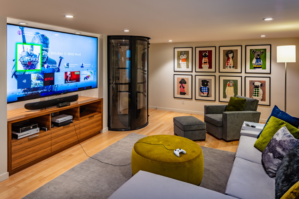 Mid-sized minimalist enclosed medium tone wood floor home theater photo in Seattle with white walls and a wall-mounted tv