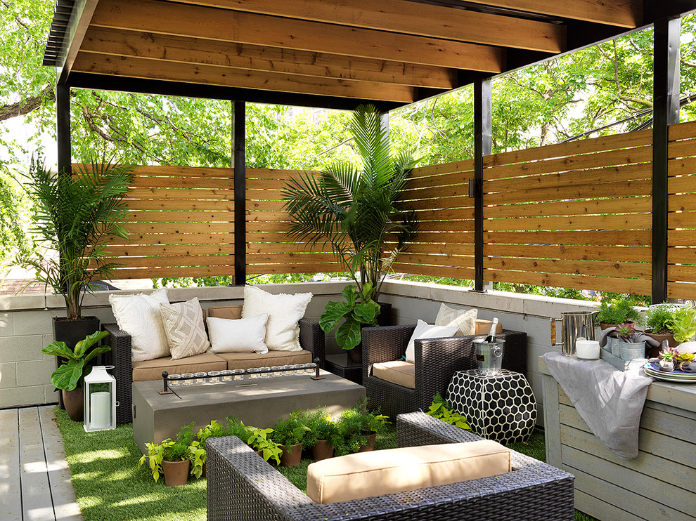 Photo of a traditional deck in Chicago with a container garden and a pergola.
