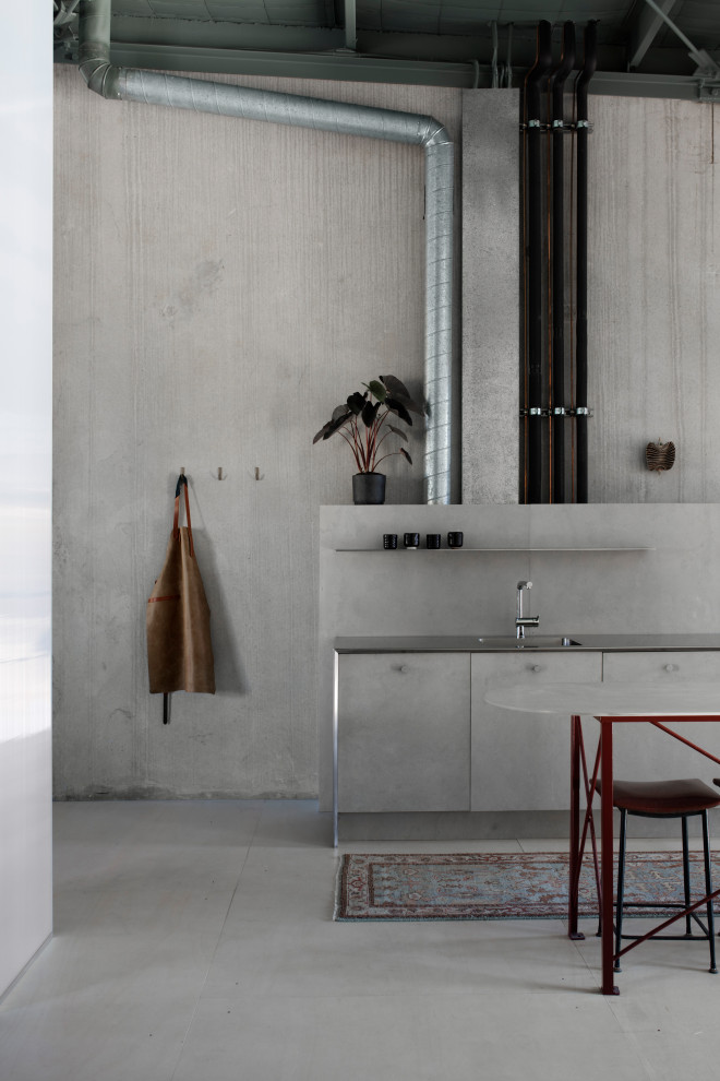 Inspiration for a mid-sized contemporary single-wall eat-in kitchen in Sydney with a single-bowl sink, grey cabinets, stainless steel benchtops, grey splashback, cement tile splashback, stainless steel appliances, plywood floors, with island, white floor and grey benchtop.