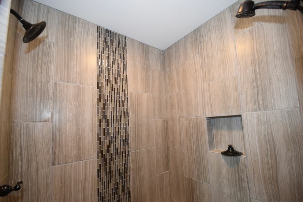 Large transitional master beige tile and ceramic tile ceramic tile drop-in bathtub photo with beige walls and granite countertops