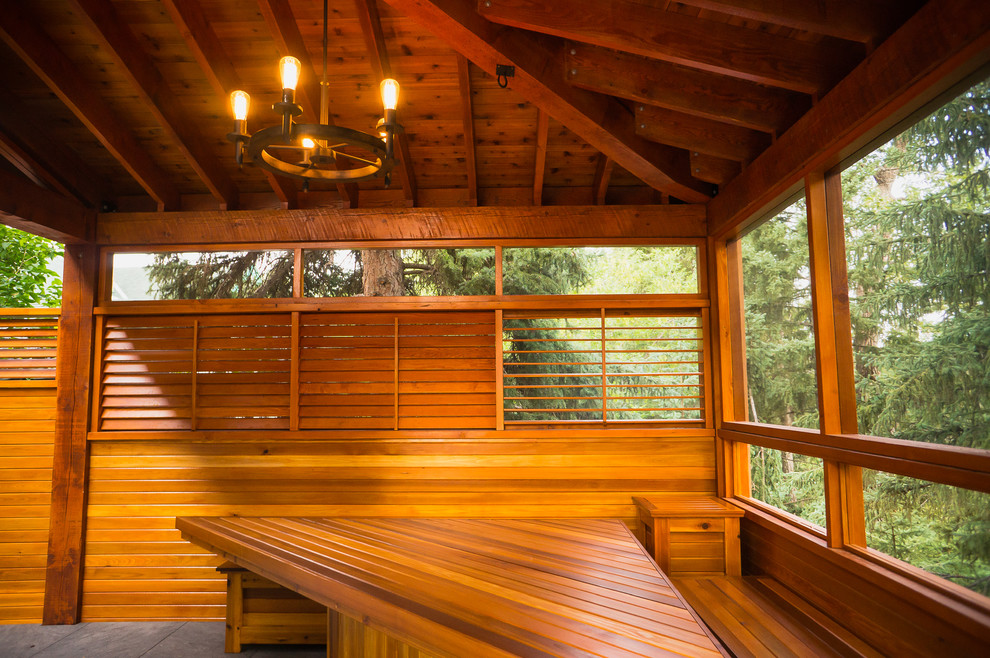 Mountain style backyard deck photo in Calgary