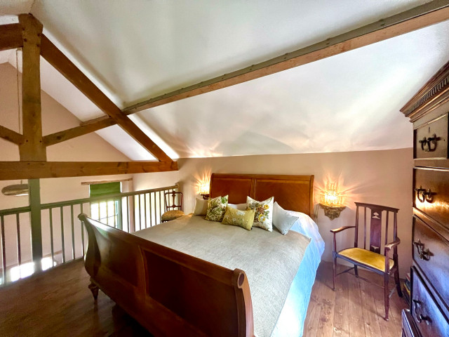 Bedroom in a chapel under the eaves farmhouse-bedroom