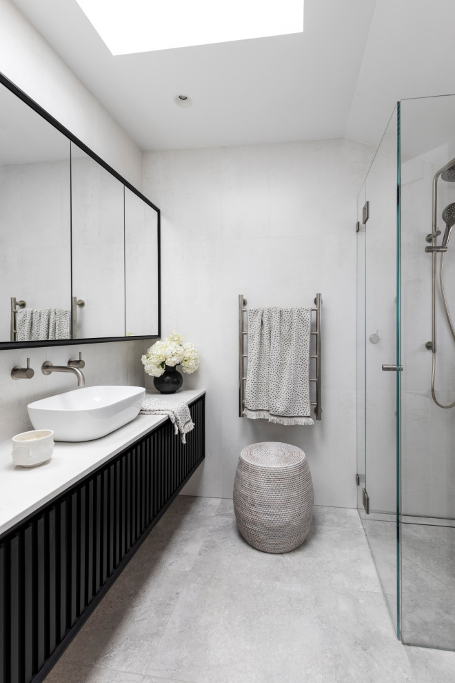 Mid-sized contemporary master bathroom in Sydney with dark wood cabinets, white tile, ceramic tile, grey walls, porcelain floors, engineered quartz benchtops, grey floor, white benchtops, a single vanity, a floating vanity and flat-panel cabinets.