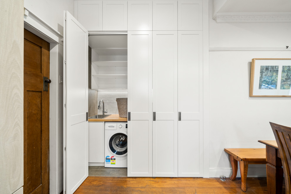 Inspiration for a transitional laundry room in Sydney.