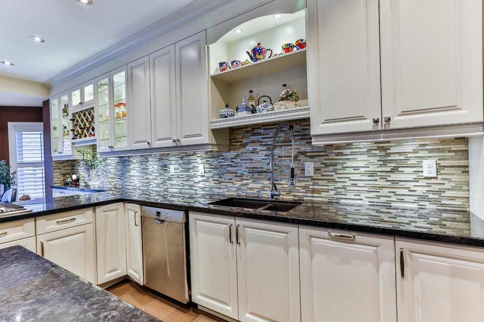 Example of a transitional kitchen design in Toronto