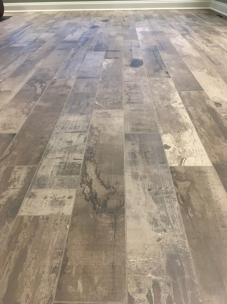 Inspiration for a large transitional porcelain tile home design remodel with no fireplace and a standard ceiling