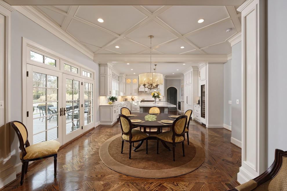 Mid-sized traditional open plan dining in DC Metro with grey walls, dark hardwood floors and brown floor.