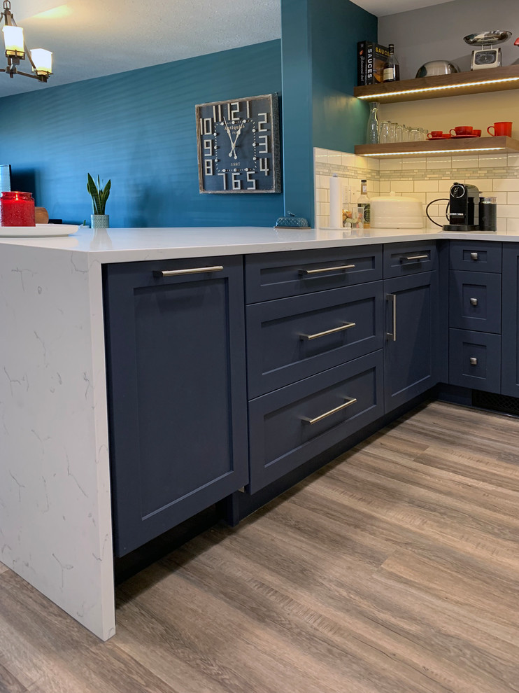 Example of a transitional kitchen design in Calgary