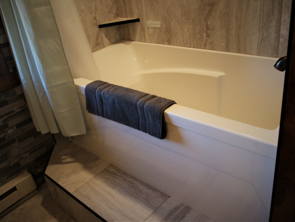 Large mountain style gray tile and stone tile bathroom photo with furniture-like cabinets, dark wood cabinets, a vessel sink, granite countertops and white countertops