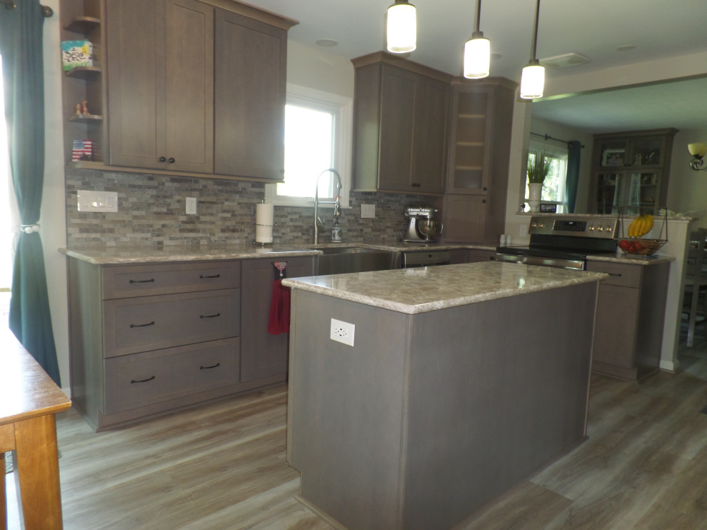Mid-sized transitional light wood floor and beige floor eat-in kitchen photo with a farmhouse sink, shaker cabinets, gray cabinets, quartz countertops, multicolored backsplash, stainless steel appliances, an island and beige countertops