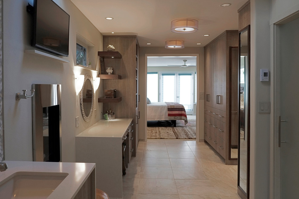 Design ideas for a large contemporary master bathroom in Seattle with an undermount sink, flat-panel cabinets, light wood cabinets, engineered quartz benchtops, a curbless shower, a wall-mount toilet, beige tile, porcelain tile, beige walls and porcelain floors.