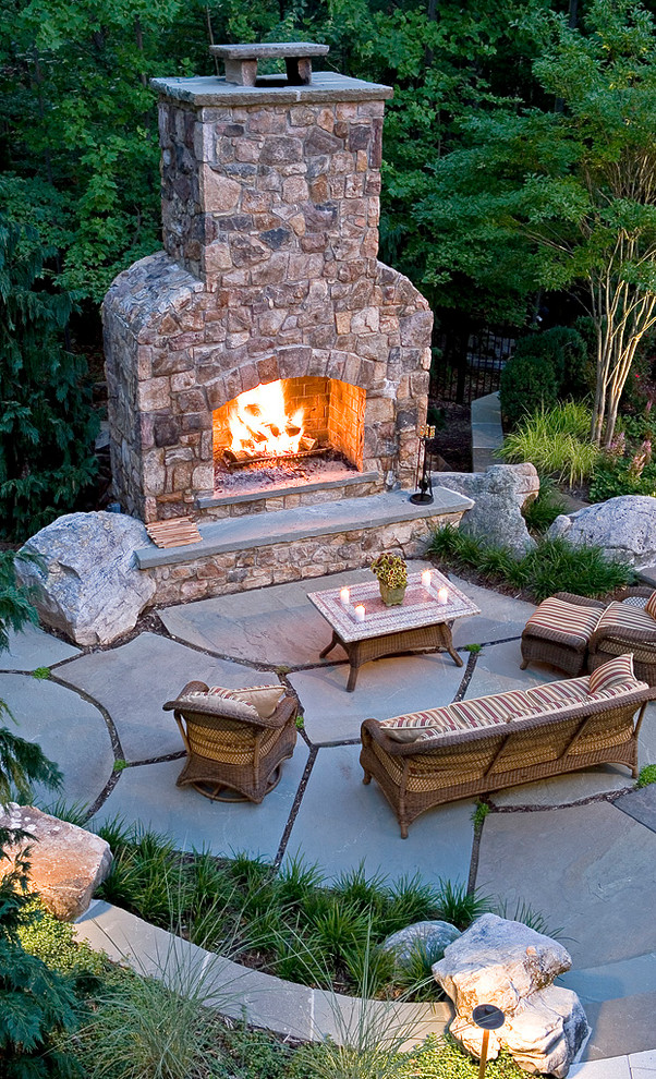 Design ideas for a mid-sized traditional backyard patio in DC Metro with a fire feature and a pergola.