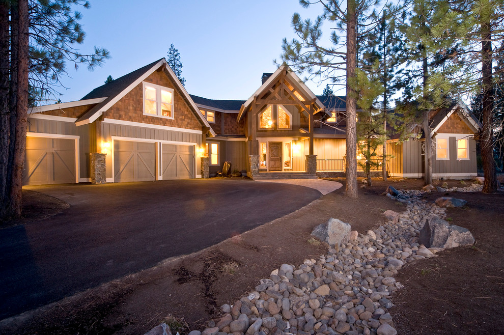 Photo of a large country two-storey exterior in Other with wood siding.