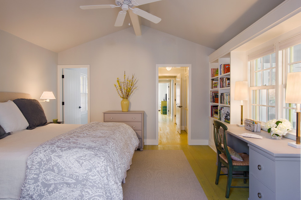 Photo of a transitional bedroom in Austin with grey walls and yellow floor.