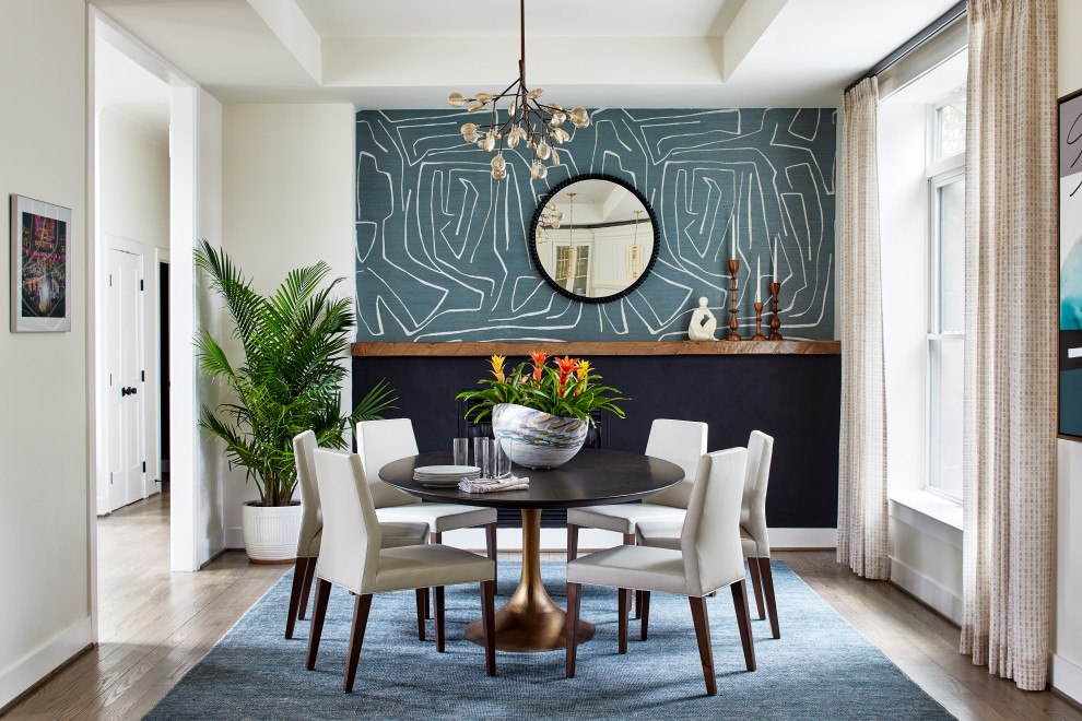 This is an example of a contemporary dining room in DC Metro with wallpaper.