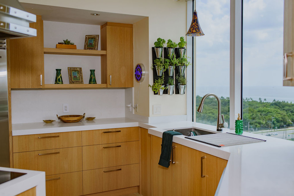 Inspiration for a mid-sized transitional u-shaped porcelain tile open concept kitchen remodel in Miami with an undermount sink, flat-panel cabinets, light wood cabinets, quartz countertops, white backsplash, stainless steel appliances, an island and white countertops