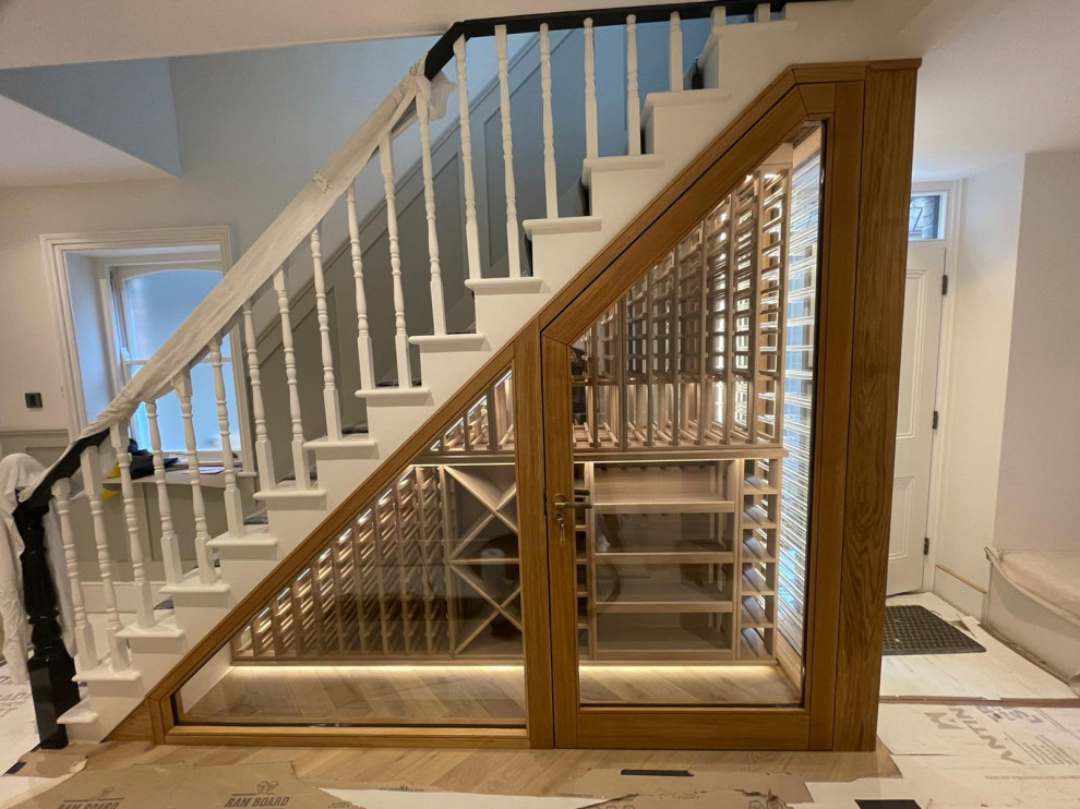 This is an example of a mid-sized traditional staircase in London.