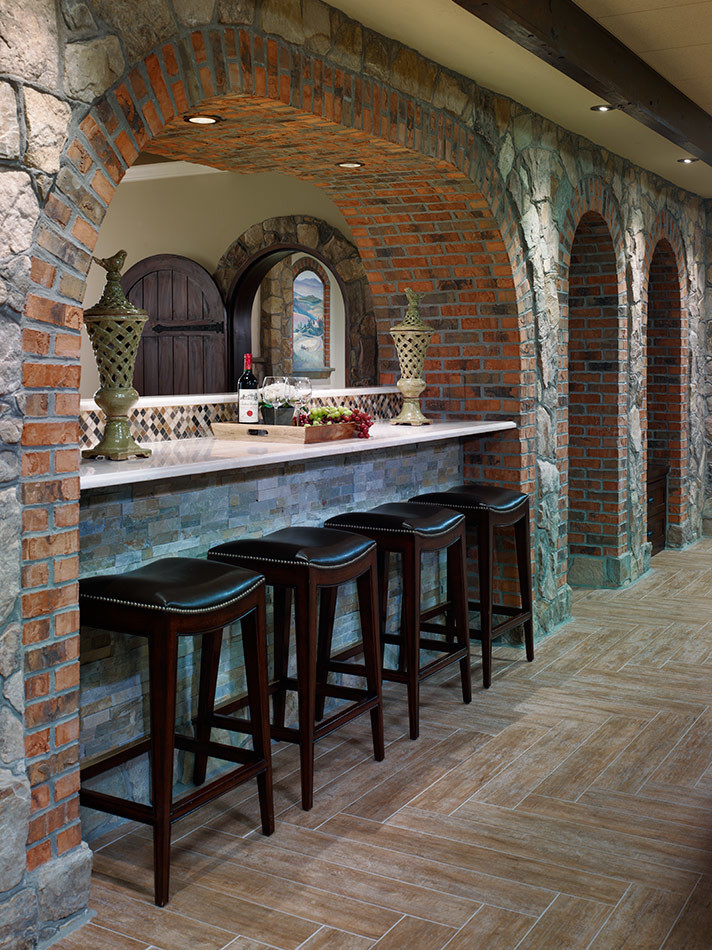 This is an example of a large mediterranean single-wall seated home bar in Philadelphia.