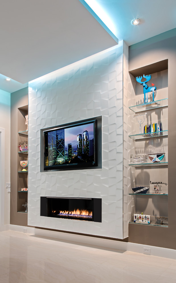 Photo of an expansive contemporary open concept family room in Miami with white walls, porcelain floors, a ribbon fireplace, a tile fireplace surround and a wall-mounted tv.